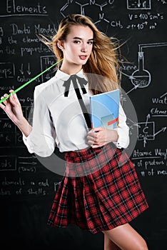 Schoolgirl by blackboard