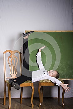 Schoolgirl with chalkboard in studio