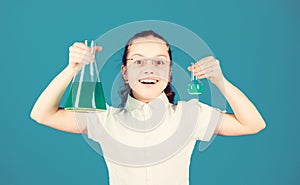 Schoolgirl with chemical liquids. Childhood and upbringing. Knowledge and information. Experimenting a bit. Small kid