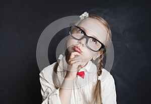 Schoolgirl Child Thinking and Looking Up. Back to School