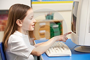 Schoolgirl In IT Class Using Computer