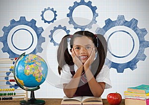 Schoolgirl at desk with settings cog gears