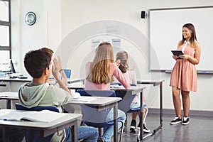 Schoolgirl giving presentation in classroom