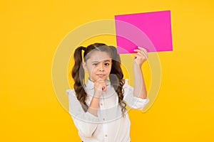 Schoolgirl hold poster copy space. News information promotion. Back to school concept. Upcoming event. Look here. Girl