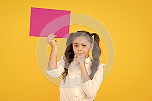 Schoolgirl hold poster copy space. News information promotion. Back to school concept. Upcoming event. Look here. Girl