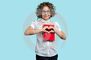 Schoolgirl holds red book