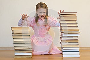 Schoolgirl is mad at books. The concept of hate to study and books. Unwillingness of a child to learn