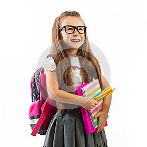 Schoolgirl with pink satchel in glasses holding