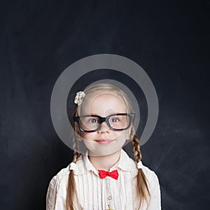 Schoolgirl portrait. Smiling child on background with copy space