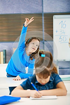 Schoolgirl raising hand