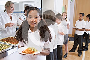 Schoolgirl in a school cafeteria