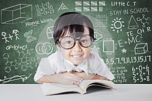 Schoolgirl with scribble background on the chalkboard