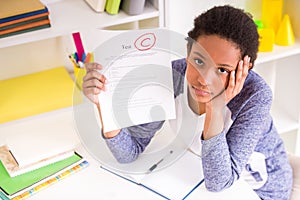 Schoolgirl showing test results