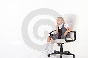Schoolgirl sit on chair and ask to be quiet