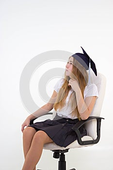 Schoolgirl sit on chair, thinking about future