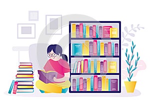 Schoolgirl sitting near bookshelf and reading books. Shelves with lot of literature of different genres. Concept of education and
