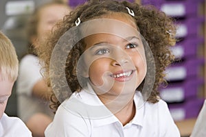 Schoolgirl sitting in primary class