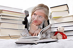 Schoolgirl or student reading books