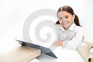 Schoolgirl studying textbook. Kid school uniform happy face read book. Excited about knowledge. Homeschooling concept