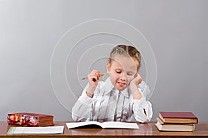 Schoolgirl thinks over the difficult task