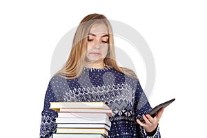 Schoolgirl trying to decide between books and an ebook reader