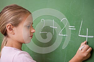 Schoolgirl writing a number