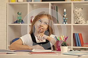 schoolgirl writing. school girl with notebook. back to school. teen girl ready to study.