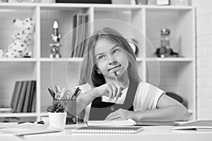 schoolgirl writing. school girl with notebook. back to school. teen girl ready to study.