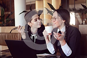 Schoolgirls Drinking Coffee Together