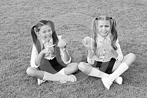 Schoolgirls eating apples relaxing schoolyard, refuse to eat concept