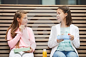 Schoolgirls have a lunch at school