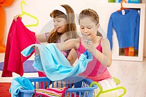 Schoolgirls helping with housework photo