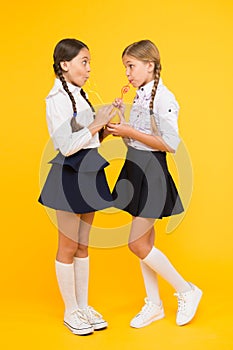 Schoolgirls sharing lunch. Healthy food. Vital habits. Fruits glucose energy source. School lunch. Vitamin nutrition