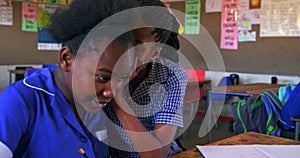 Schoolgirls talking in a lesson at a township school 4k