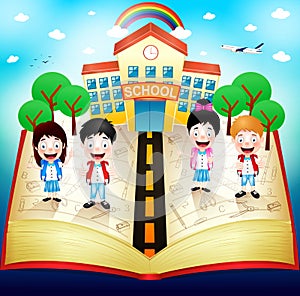 Schooling Children On Top Of Red Book With School Building And Rainbow photo