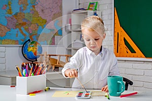 Schoolkid or preschooler learn. Portrait of Pupil of primary school study indoors. Home schooling.