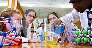 Schoolkids experimenting chemical in laboratory 4k