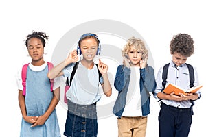 Schoolkids listening music in wireless headphones