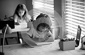 Schoolkids studying homework math during lesson at classroom, education concept, Cute schooler.