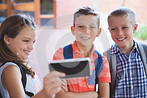 Schoolkids taking selfie from mobile phone