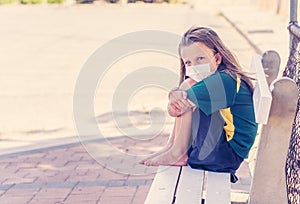 Schools closures Coronavirus lockdown. Bored and sad schoolgirl feeling depressed and lonely