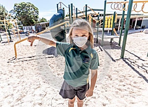 Schools closures Coronavirus lockdown. Bored school kid alone in playground feeling sad and lonely