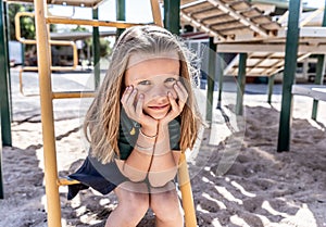 Schools closures Coronavirus lockdown. Bored school kid alone in playground feeling sad and lonely