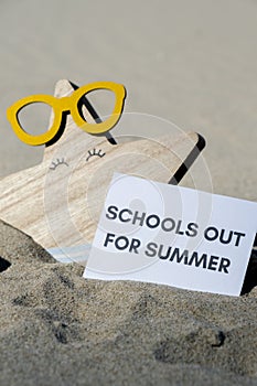 SCHOOLS OUT FOR SUMMER text on paper greeting card on background of funny starfish in glasses summer vacation decor