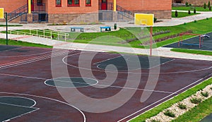Schoolyard with a playground for basketball. photo