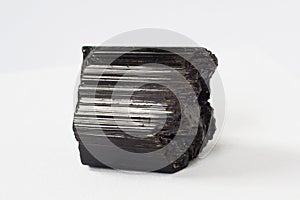 Schorl mineral also black tourmaline on white background