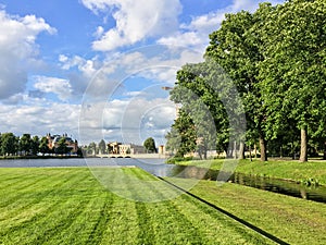 Schwerin castle in a green landscape and cloudy sky