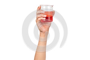 Science beaker with red water or red liquid holding by boy hand isolated on white background. Hand showing science beaker in