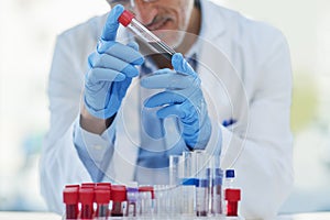 Science, blood and hands of man with test tube for biotech engineering, pathology and hematology research. Laboratory photo