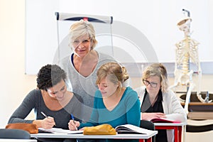 science class with teacher and three female students